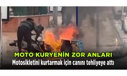Alev alev yanan motosikletini kurtarmak için canını tehlikeye attı